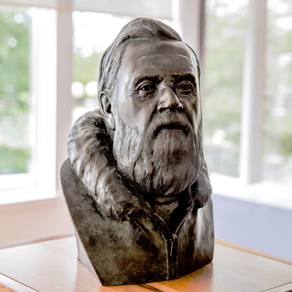 A carved bust of Farley Mowat